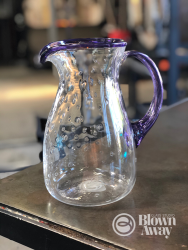 blown glass pitcher with bubbles. Blown handle and thick lip wrap in hyacinth