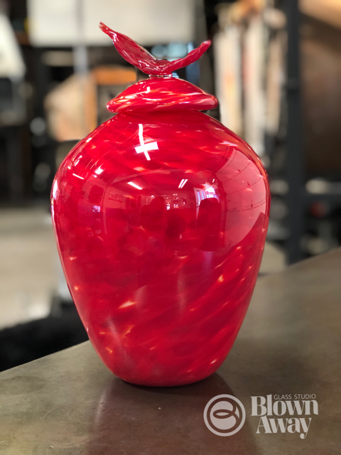 Blown glass Feather Urn in Red over white.  Frit with optic mold for subtle lines